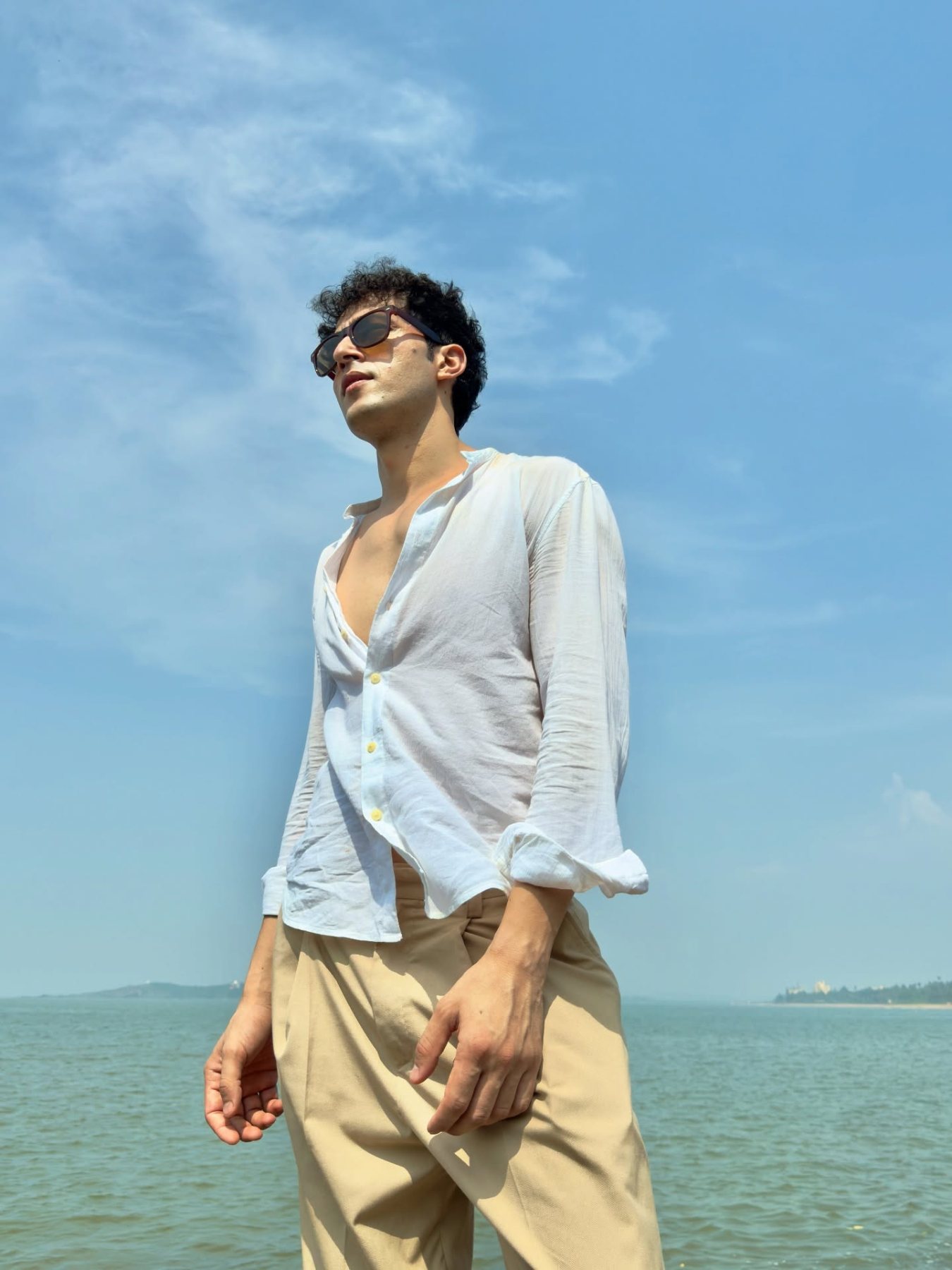 Raff by the sea under an open blue sky